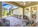 Relaxing screened lanai with ample seating, perfect for enjoying the outdoors at 6002 Thrushwood Rd, Lithia, FL 33547