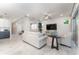 Bright living room featuring stylish furniture, decorative accents, and sliding glass doors to bring the outdoors in at 6002 Thrushwood Rd, Lithia, FL 33547