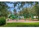 Community playground with swings and climbing structures provides a fun space for children to play outdoors at 6002 Thrushwood Rd, Lithia, FL 33547