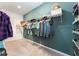 Spacious walk-in closet features ample shelving and hanging space for organized storage at 6002 Thrushwood Rd, Lithia, FL 33547