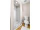 Clean bathroom featuring a standard toilet and a walk-in shower with tiled walls at 750 E Harbor S Dr, St Petersburg, FL 33705