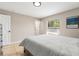 Neutral bedroom featuring a window providing natural light and tile flooring at 750 E Harbor S Dr, St Petersburg, FL 33705