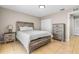 Well-lit bedroom with rustic furniture and tile flooring at 750 E Harbor S Dr, St Petersburg, FL 33705