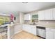 Bright kitchen featuring stainless steel appliances, breakfast bar, and casual dining area at 750 E Harbor S Dr, St Petersburg, FL 33705