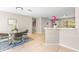 Bright kitchen featuring stainless steel appliances, breakfast bar, and casual dining area at 750 E Harbor S Dr, St Petersburg, FL 33705