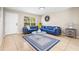 Inviting living room with tile flooring, a large window, and a comfortable blue sectional sofa at 750 E Harbor S Dr, St Petersburg, FL 33705