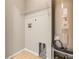 Utility room equipped with shelving, water connections, and a water heater at 750 E Harbor S Dr, St Petersburg, FL 33705