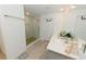 Bright bathroom showcasing a glass shower enclosure, double vanity and contemporary design and layout at 7711 Rosewood Garden Loop, Tampa, FL 33637