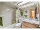 Cozy bathroom featuring a vanity, bathtub, and tile surround at 7717 Radcliffe Cir, Port Richey, FL 34668