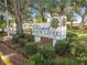 Sign for The Orchards of Radcliffe, a deed-restricted adult living community for over 55 at 7717 Radcliffe Cir, Port Richey, FL 34668