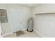 Utility room with water heater and access door at 7957 Cottonwoode Dr, Largo, FL 33773