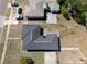 Aerial view of a single-Gathering home showcasing the roof, driveway, and surrounding yard space at 801 37Th S Ave, St Petersburg, FL 33705