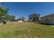 Expansive backyard with lush green grass and fencing, offering privacy and room for outdoor activities at 801 37Th S Ave, St Petersburg, FL 33705