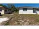 Residential house with a dry lawn, sidewalk, and street view on a sunny day at 801 37Th S Ave, St Petersburg, FL 33705