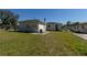 Spacious backyard with ample green space and chain link fence at 801 37Th S Ave, St Petersburg, FL 33705