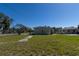 Backyard and side view of a home with a dry yard and street at 801 37Th S Ave, St Petersburg, FL 33705