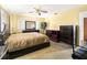 Bedroom featuring carpet, furniture, ceiling fan, and natural light at 801 37Th S Ave, St Petersburg, FL 33705