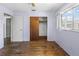 Bedroom with wood floors, closet, and natural light from a large window at 801 37Th S Ave, St Petersburg, FL 33705