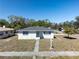 Charming single-story home featuring a well-maintained front yard and sidewalk leading to the front door at 801 37Th S Ave, St Petersburg, FL 33705