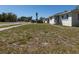 Residential house with a dry lawn, sidewalk, and street view on a sunny day at 801 37Th S Ave, St Petersburg, FL 33705