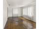 Spacious living room with natural light from large windows and hardwood floors at 801 37Th S Ave, St Petersburg, FL 33705