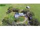 Aerial view of a sprawling estate featuring a pool, well-maintained grounds, and multiple outbuildings at 808 Old Welcome Rd, Lithia, FL 33547
