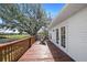 Spacious back deck with chairs with an expansive view of the backyard at 808 Old Welcome Rd, Lithia, FL 33547