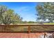 Enjoy expansive backyard views from this wood back deck with wood railing at 808 Old Welcome Rd, Lithia, FL 33547
