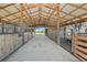 View of the barn featuring horse stalls and a secure design to protect animals from weather and provides proper ventilation at 808 Old Welcome Rd, Lithia, FL 33547