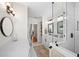 Bathroom featuring glass shower, modern vanity, mirror, and hexagon tile flooring at 808 Old Welcome Rd, Lithia, FL 33547