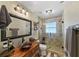 Bathroom with a custom vanity, an ornate mirror, a walk-in shower and decorative tiled flooring at 808 Old Welcome Rd, Lithia, FL 33547