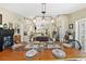 Open-concept kitchen and dining area featuring white cabinets and a spacious island with seating at 808 Old Welcome Rd, Lithia, FL 33547