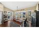 Dining room with stainless refrigerator, french doors, large windows overlooking the pool and spacious backyard at 808 Old Welcome Rd, Lithia, FL 33547
