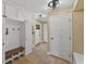 Mud room features built in bench with storage, coat hooks and a tile floor at 808 Old Welcome Rd, Lithia, FL 33547