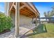 A spacious patio is shown leading towards the screened in lanai and pool at 808 Old Welcome Rd, Lithia, FL 33547