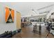 Garage featuring open doors, workout equipment, and storage at 808 Old Welcome Rd, Lithia, FL 33547