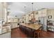 Gourmet kitchen featuring custom cabinets, granite countertops, stainless steel appliances, and a large center island at 808 Old Welcome Rd, Lithia, FL 33547