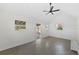 Bright open floorplan with a ceiling fan and natural lighting at 808 Old Welcome Rd, Lithia, FL 33547