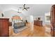 Bright main bedroom featuring hardwood floors, vaulted ceiling, and abundant natural light at 808 Old Welcome Rd, Lithia, FL 33547