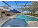 Screened pool with lounge chairs, umbrella and outdoor dining area at 808 Old Welcome Rd, Lithia, FL 33547