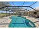 Stunning screened pool and patio with backyard views, perfect for relaxation and outdoor dining at 808 Old Welcome Rd, Lithia, FL 33547