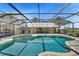 Beautiful screened pool with backyard view, outdoor dining area, and poolside seating at 808 Old Welcome Rd, Lithia, FL 33547