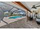 Screened pool and outdoor dining area perfect for entertaining at 808 Old Welcome Rd, Lithia, FL 33547
