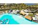 Expansive aerial shot of the lagoon-style community pool and the surrounding amenities at 8261 Ivy Stark Blvd, Wesley Chapel, FL 33545