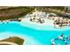Aerial view of the stunning turquoise community pool at 8261 Ivy Stark Blvd, Wesley Chapel, FL 33545