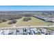 Aerial view of houses, landscape, and beautiful open fields at 8261 Ivy Stark Blvd, Wesley Chapel, FL 33545