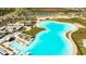 An aerial view of the community pool surrounded by an expansive community at 8261 Ivy Stark Blvd, Wesley Chapel, FL 33545