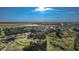 Community aerial shot featuring well-maintained homes, mature trees, and picturesque open spaces at 8261 Ivy Stark Blvd, Wesley Chapel, FL 33545