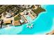 Aerial view of pool-side lounge areas and beach cabanas next to the community's stunning turquoise lagoon at 8261 Ivy Stark Blvd, Wesley Chapel, FL 33545