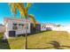 A spacious, well-maintained backyard with lush grass and privacy fence offers a serene outdoor living space at 8261 Ivy Stark Blvd, Wesley Chapel, FL 33545